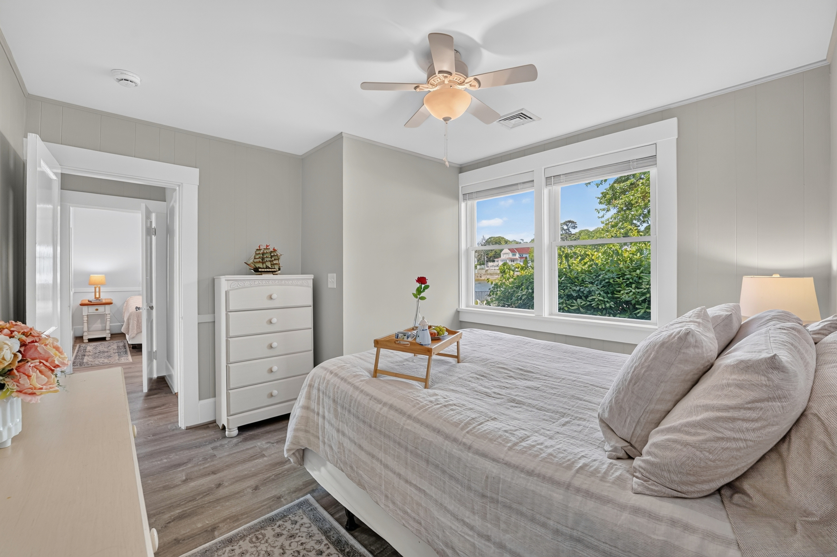 Unwind in this tranquil bedroom with large windows overlooking the surrounding landscape.