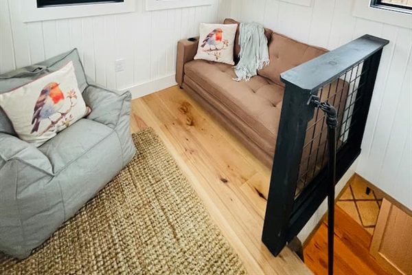 Third story lookout tower. This futon pulls out into a twin bed.
Please note: the only access is by the ships ladder.