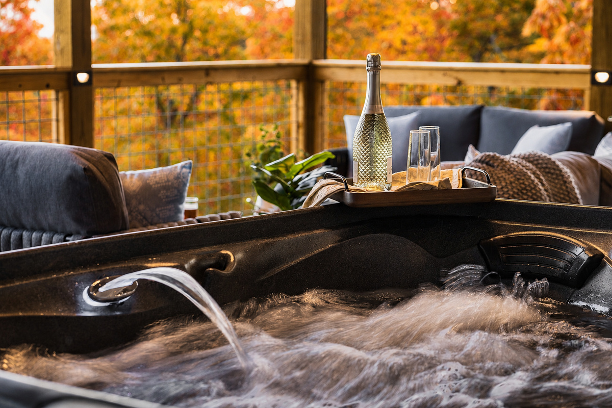 Come soak in luxury on our covered deck, with panoramic Smoky Mountain views