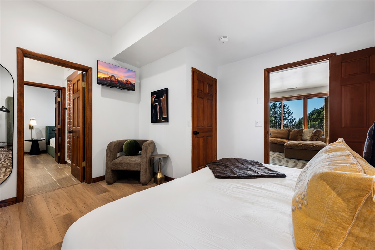 Comfortable suite with TV and easy access to living spaces.