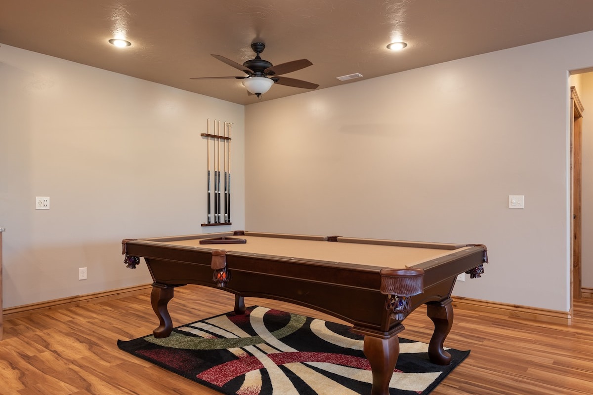 Enjoy the pool table with a changeable ping pong tabletop in the basement.