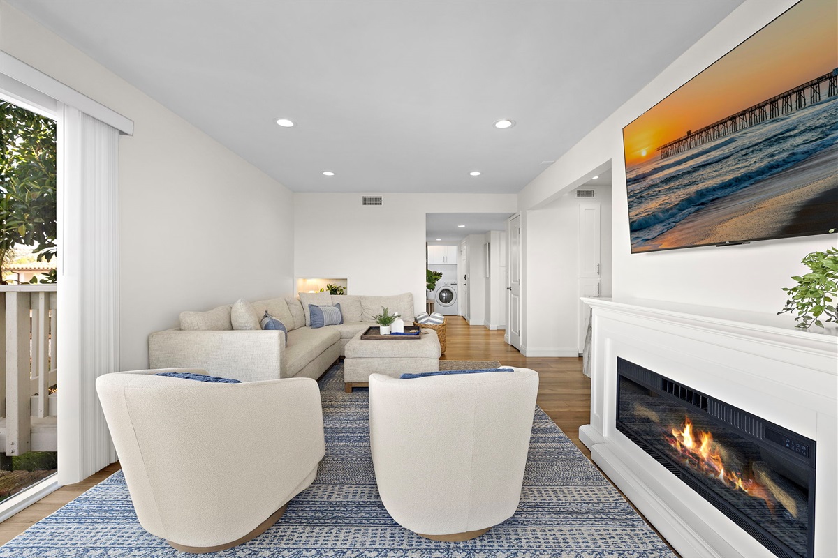 Cozy up by the fireplace or swivel to see the ocean and watch the sunset
