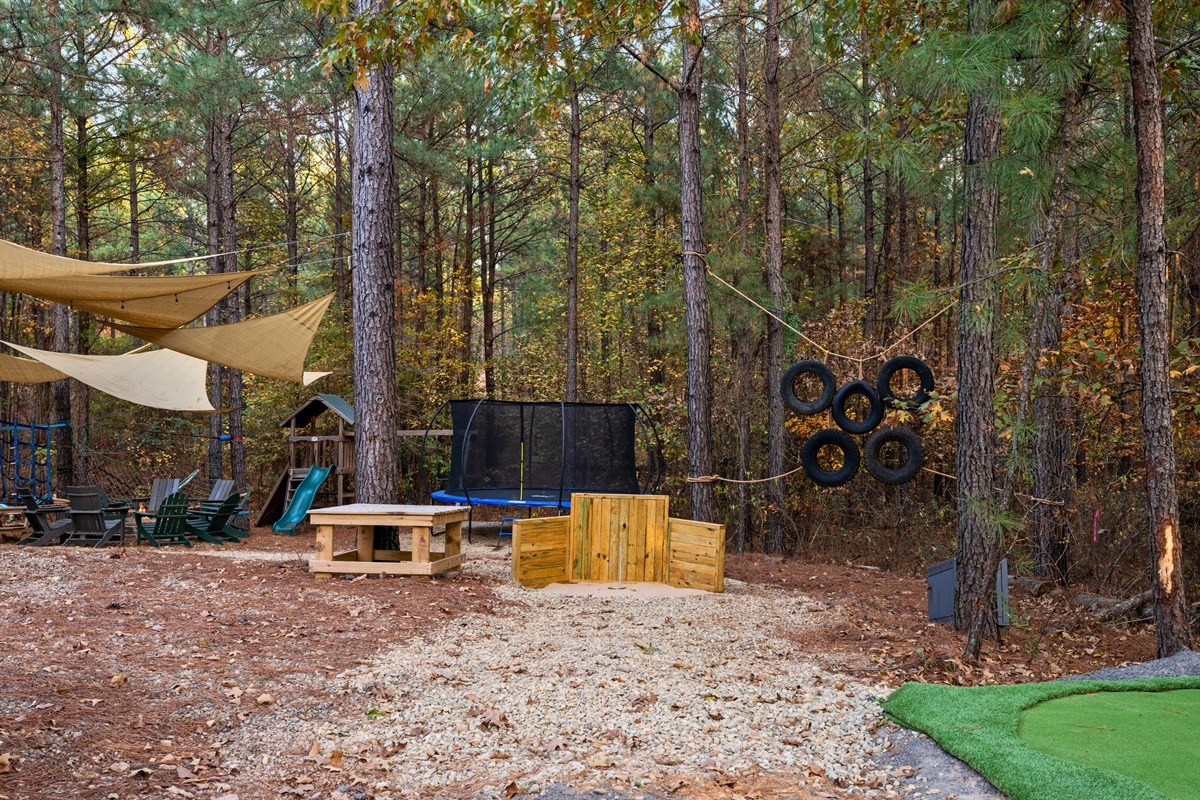 This view shows off the horseshoe pit tucked beneath the trees, giving everyone a fun and relaxed spot to toss a few rings and enjoy a little friendly competition outdoors.