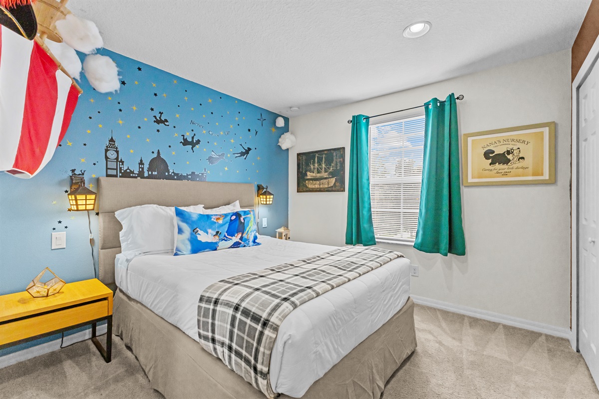 Peter Pan themed bedroom with playful decor and comfortable bedding
