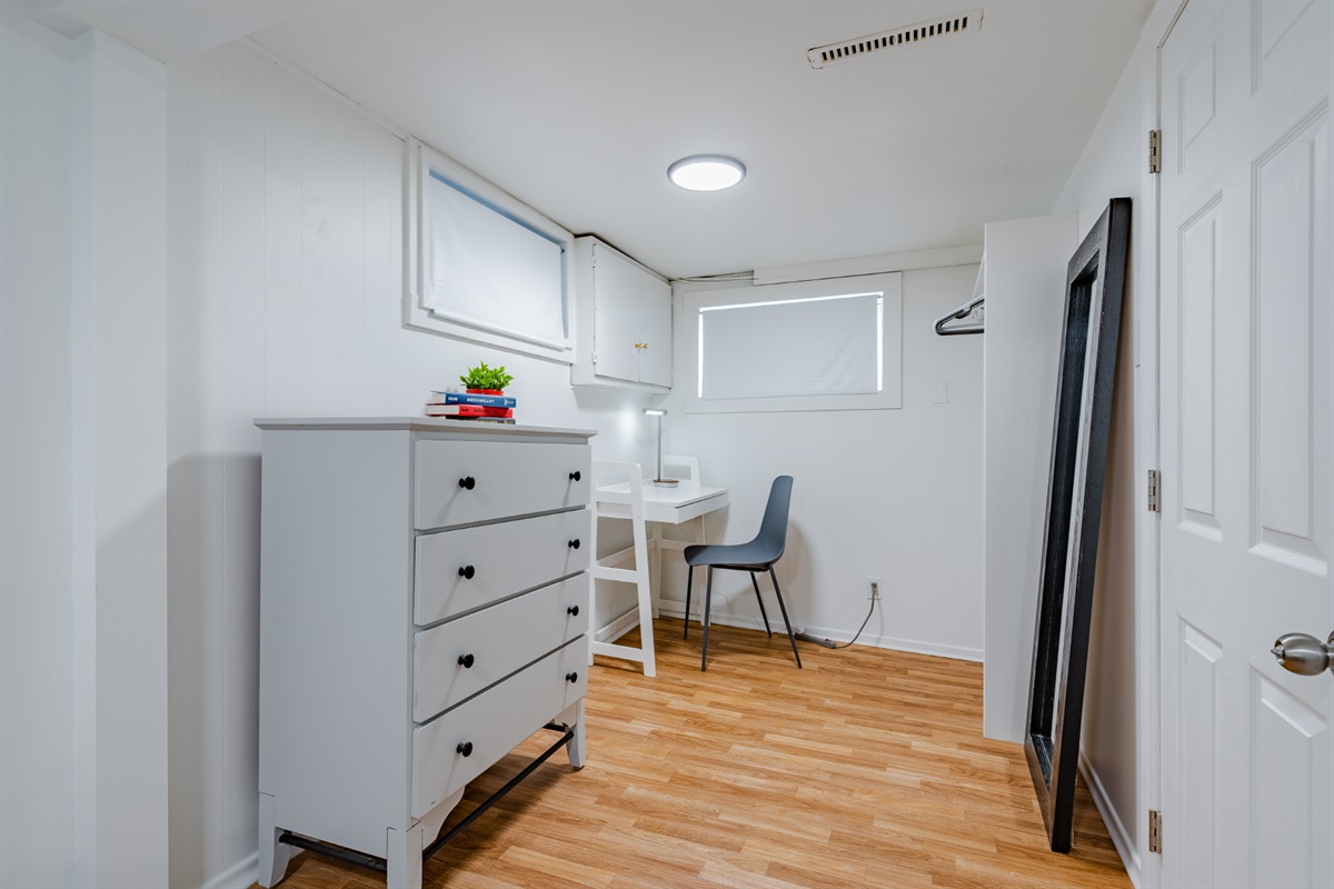 Small workspace and storage area, best suited for light laptop use.