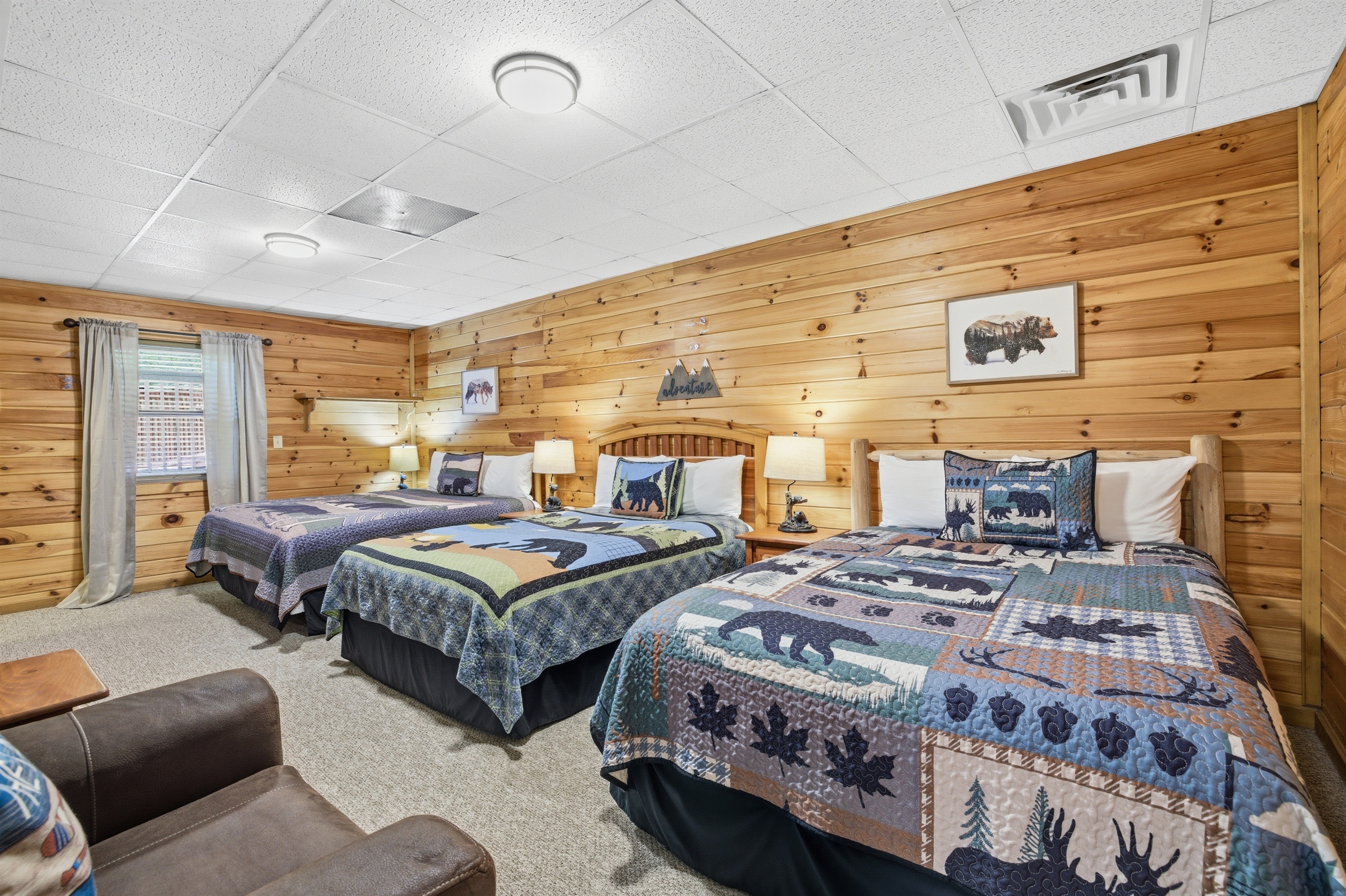 King and 2 Queen Beds w TV and attached bathroom.