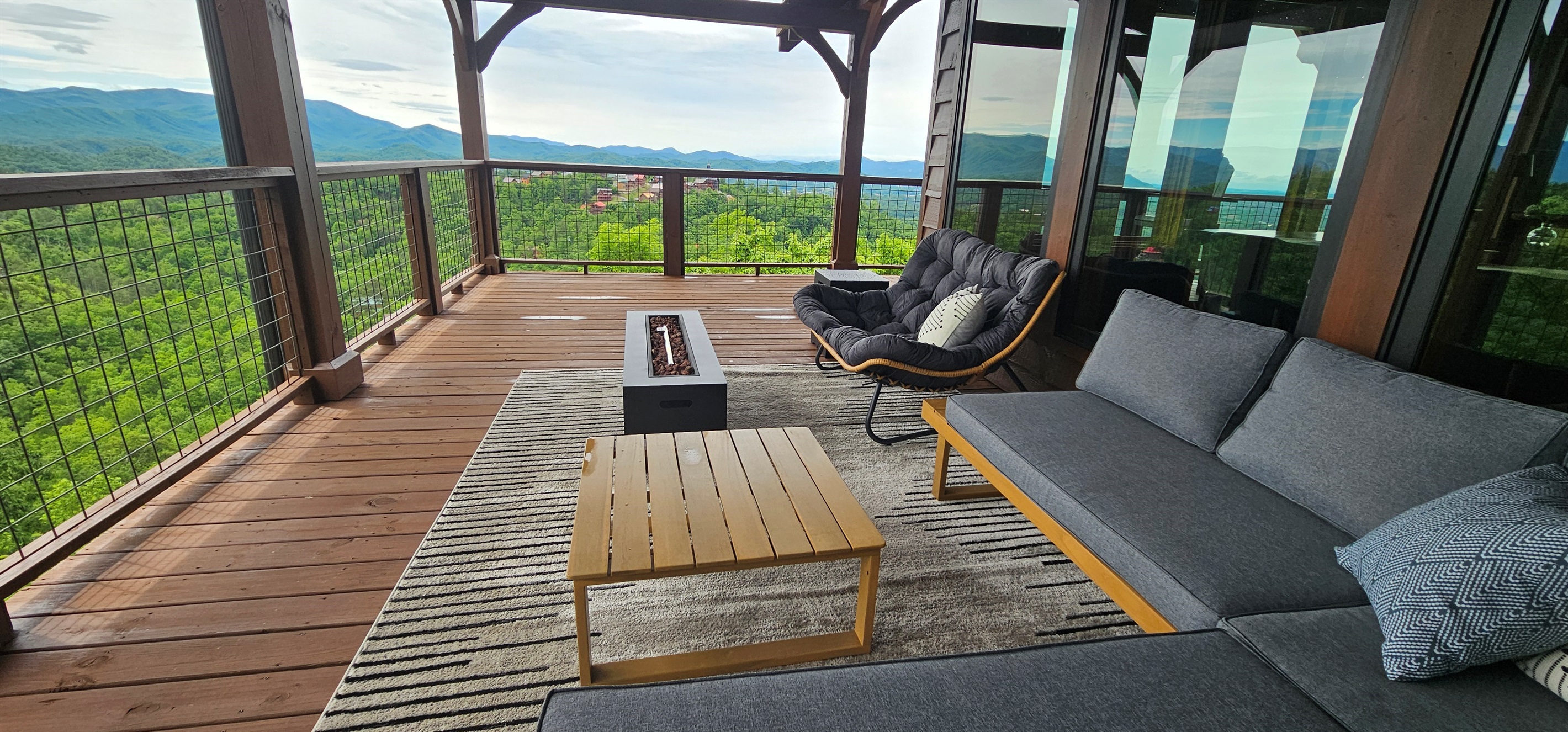 You can't go wrong with an afternoon fire in this sitting area looking at Mount Le Conte. That papasan chair is perfect for a nap or some cozying up.