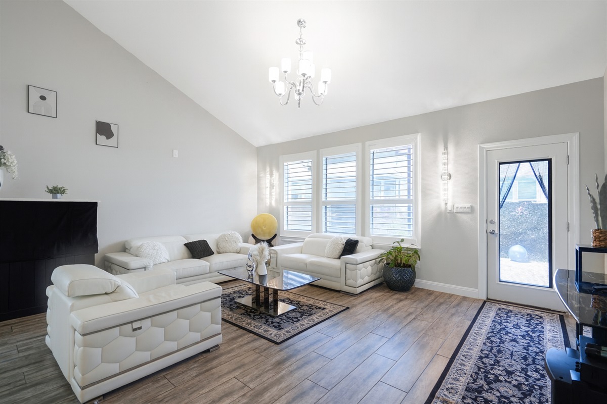 🛋 Living Room  “Cathedral ceilings, leather seating, and vibes that feel like vacation.”