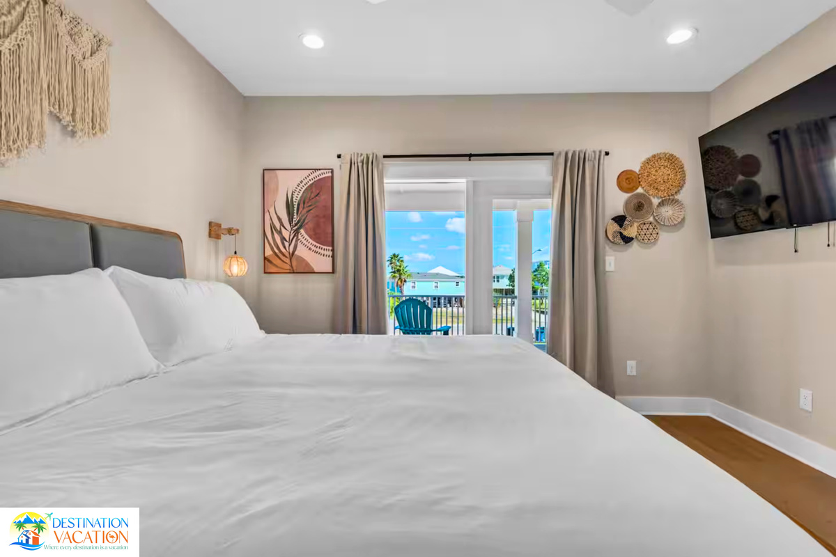 A serene bedroom retreat overlooking breathtaking coastal scenery.