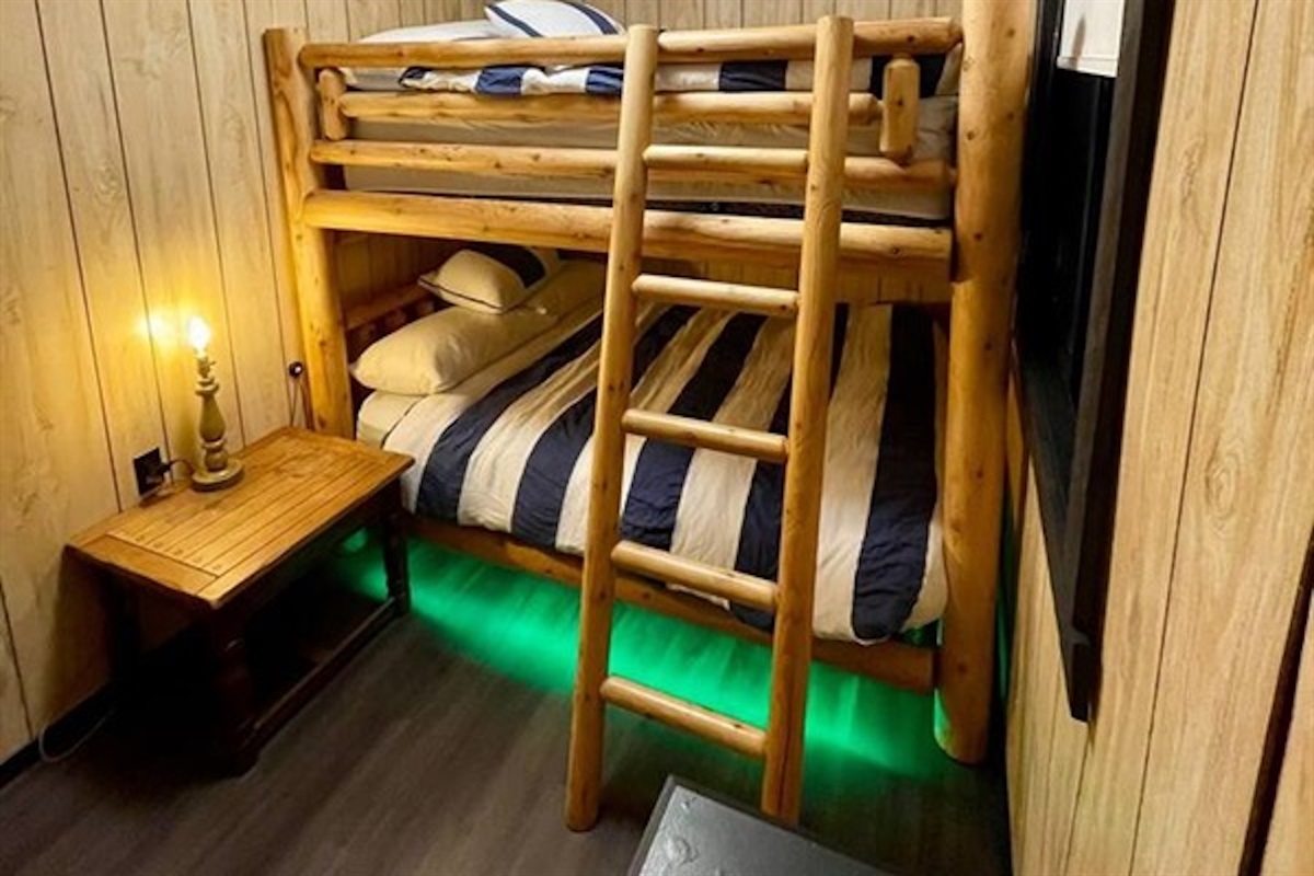 Bunk beds with warm lighting and built-in storage
