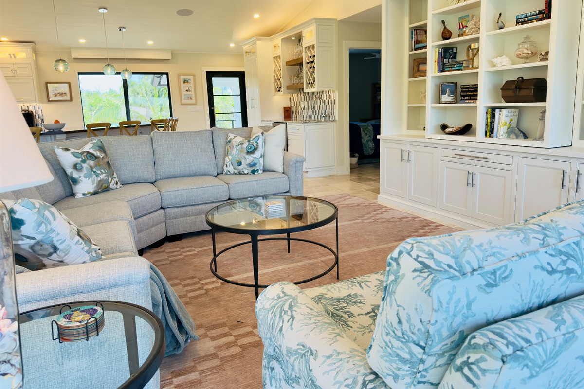 Livingroom with tv hidden behind bookcase