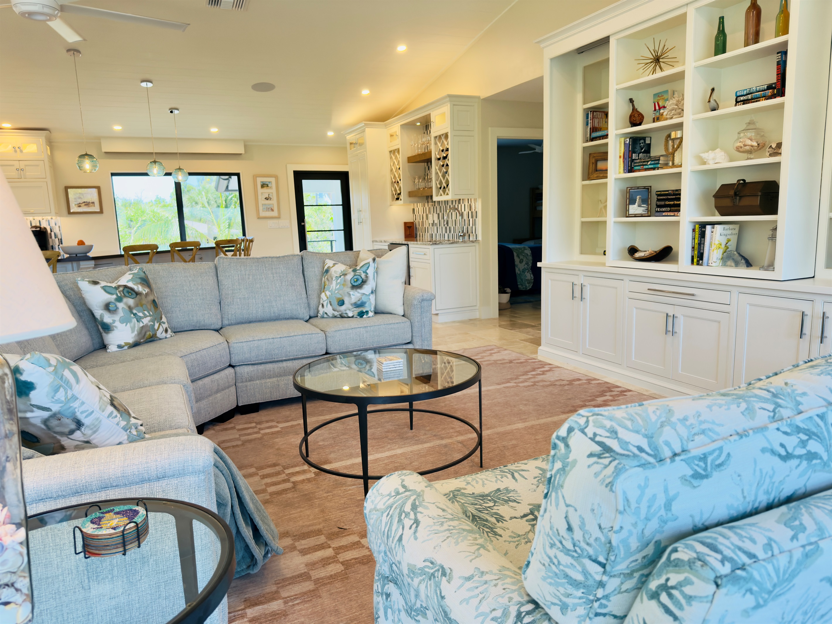 Livingroom with tv hidden behind bookcase