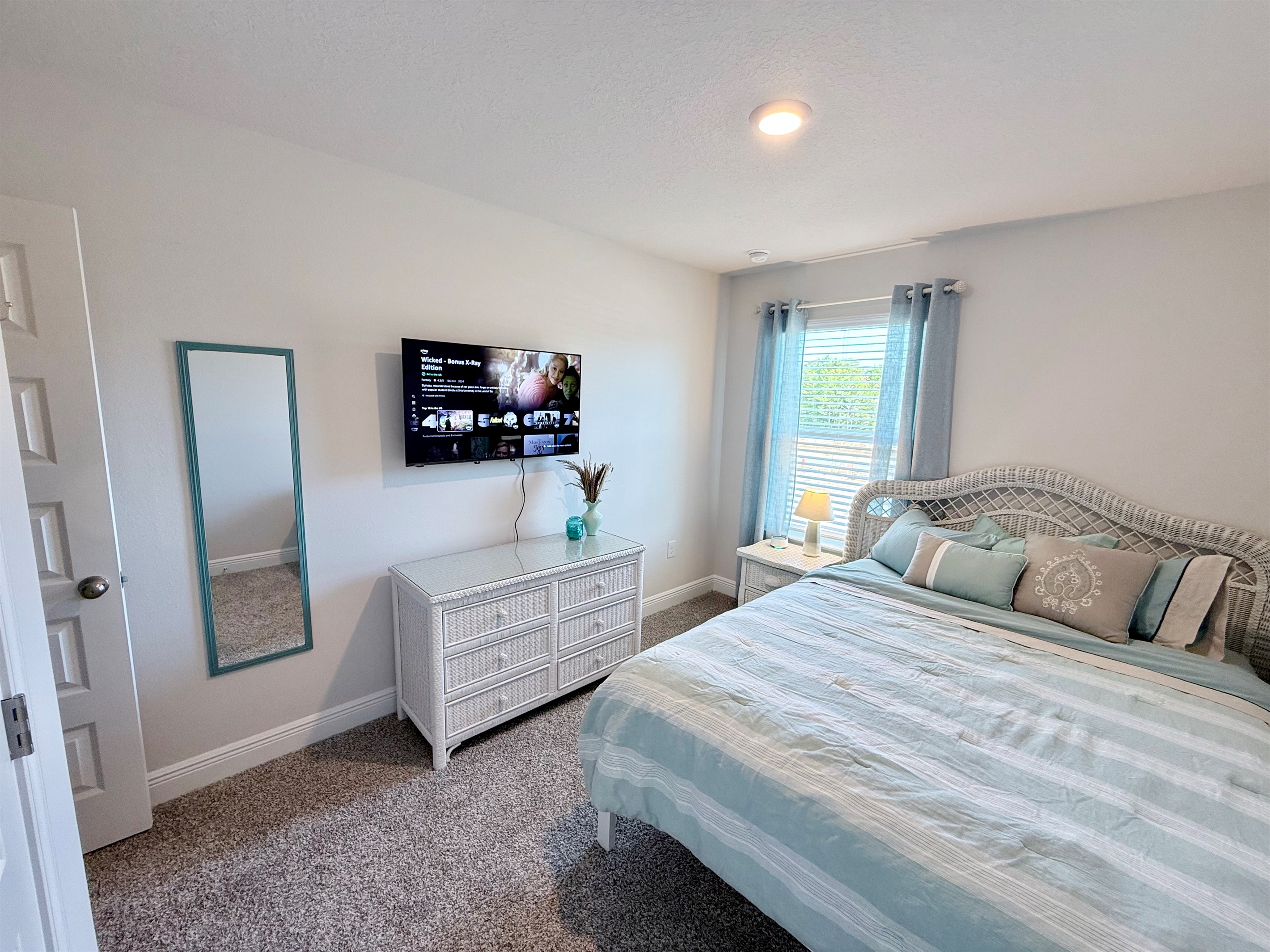 Queen bedroom with 43" 4K HDR Smart TV