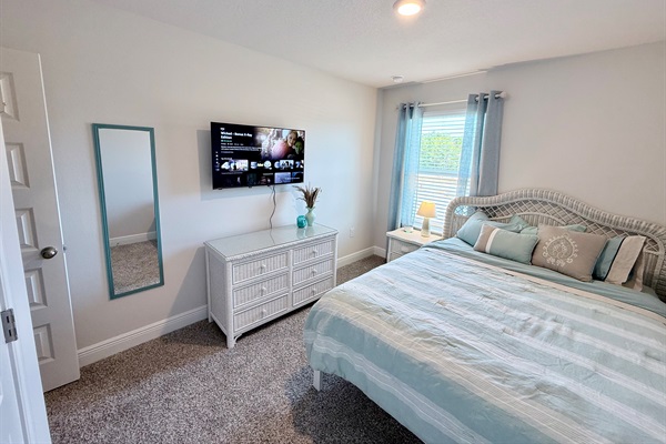Queen bedroom with 43" 4K HDR Smart TV