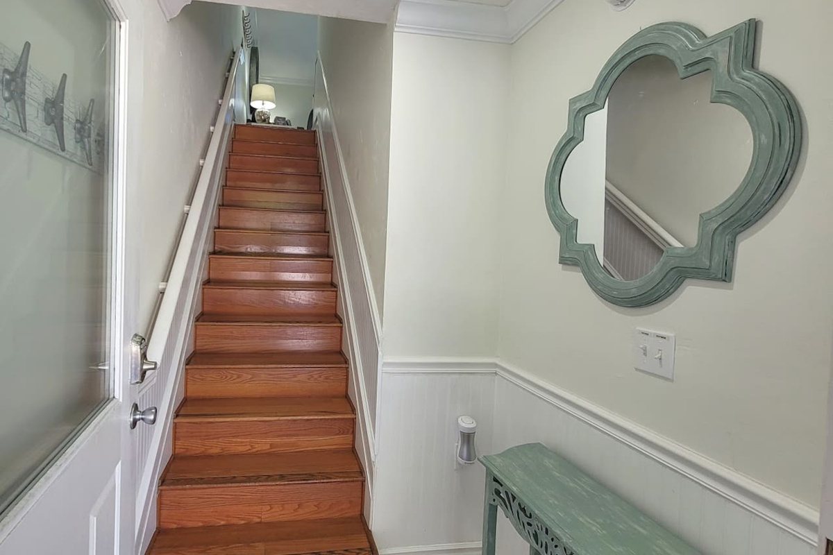 Walk through the foyer and head up the stairs &mdash; the whole home opens up the moment you arrive and the main level is already waiting.