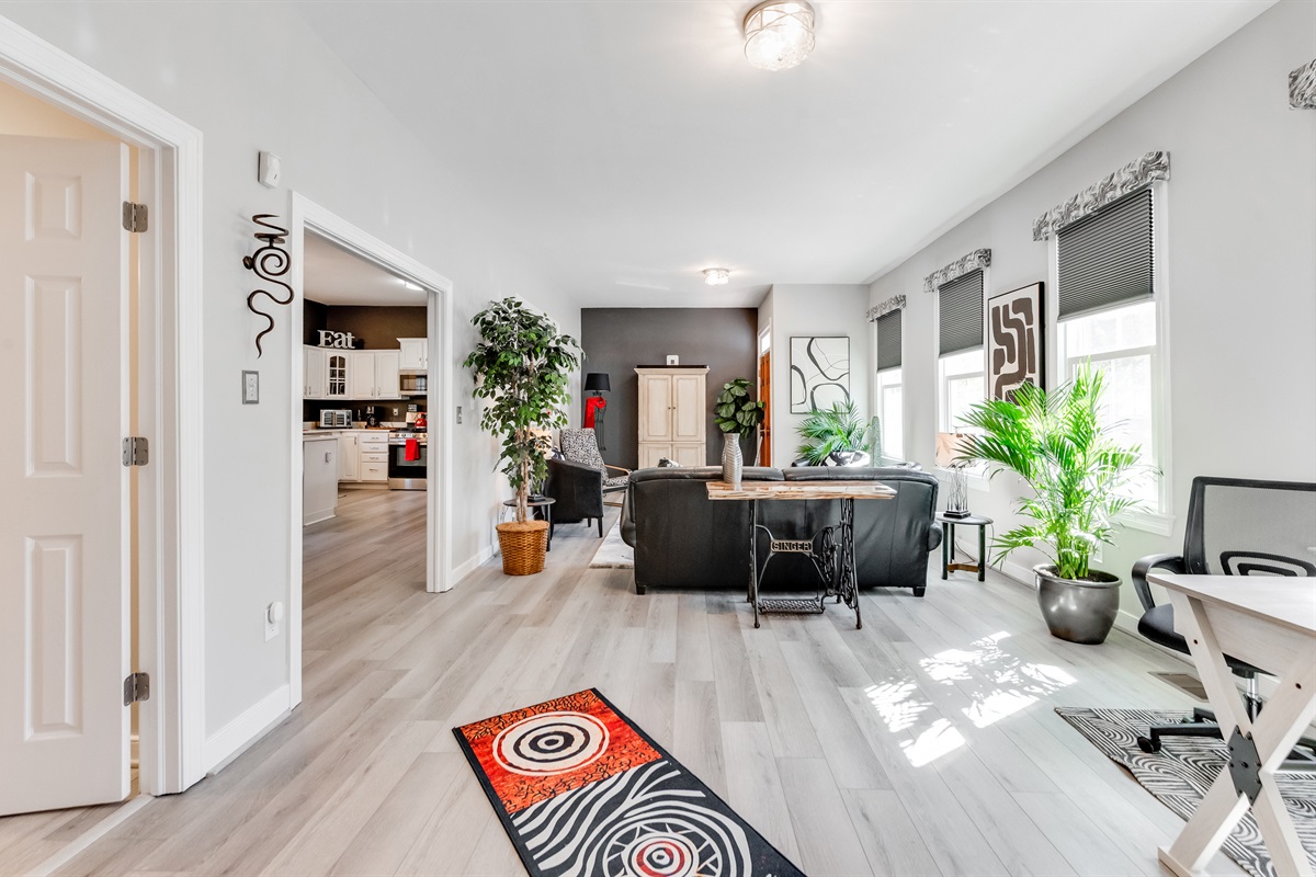 Living Room: Bright and inviting space, perfect for relaxation with vibrant decor and lush greenery!