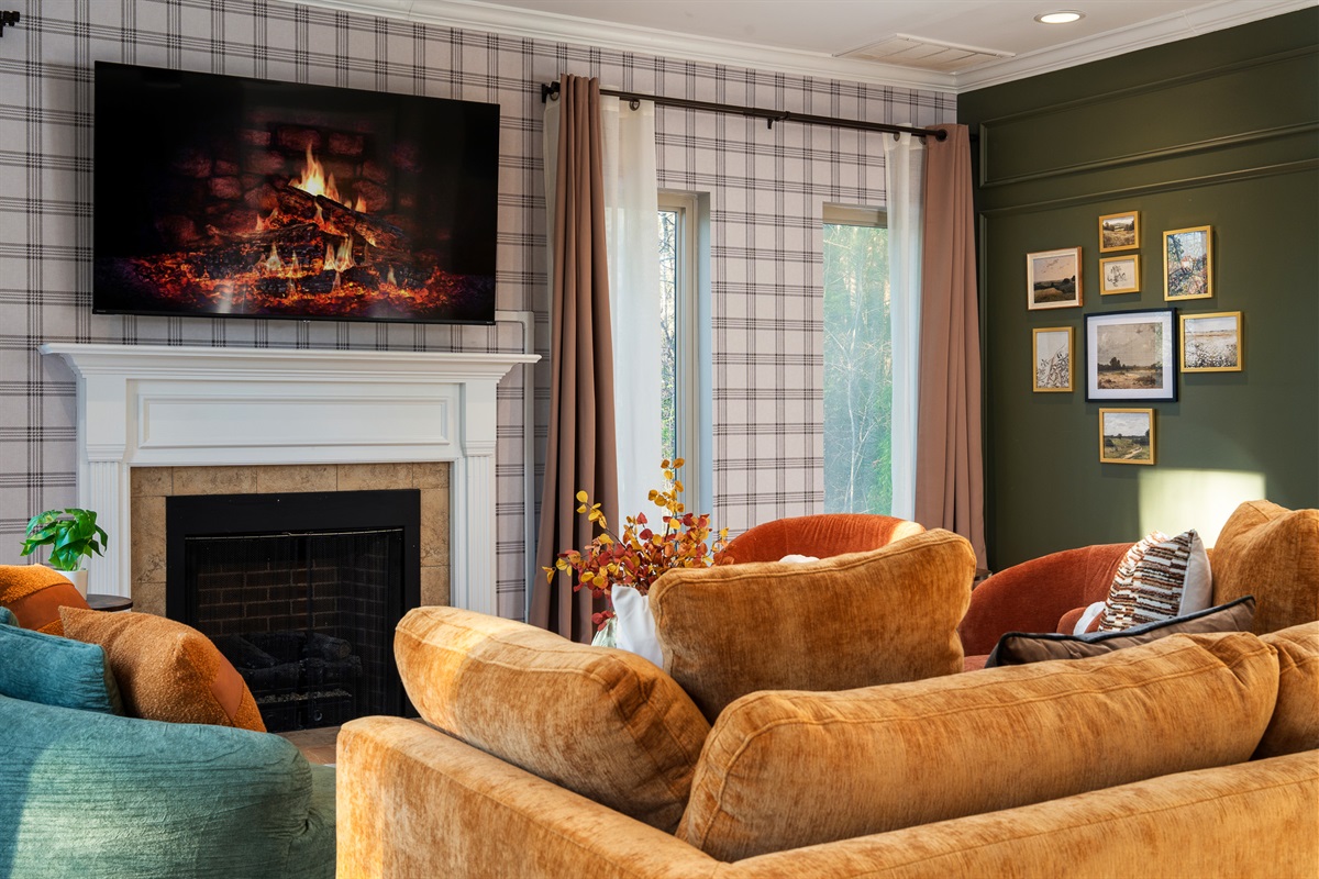 Warm, inviting living room with fireplace and TV - great for winding down after a day at Biltmore or downtown Asheville