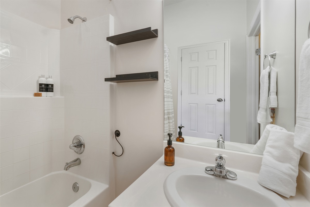 Primary ensuite bathroom with a full tub/shower—perfect for unwinding at the end of the day.