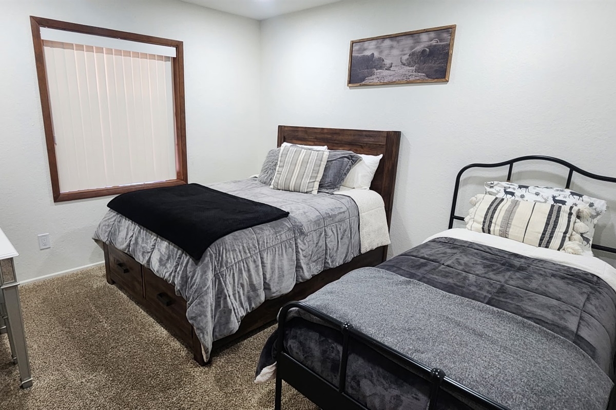 Bedroom 3 has one double bed and one twin bed.