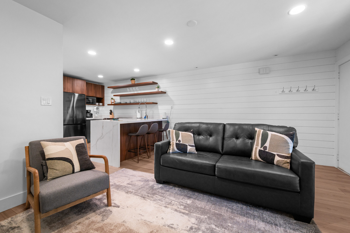 Open-concept living room and kitchen designed for gathering with family and friends.