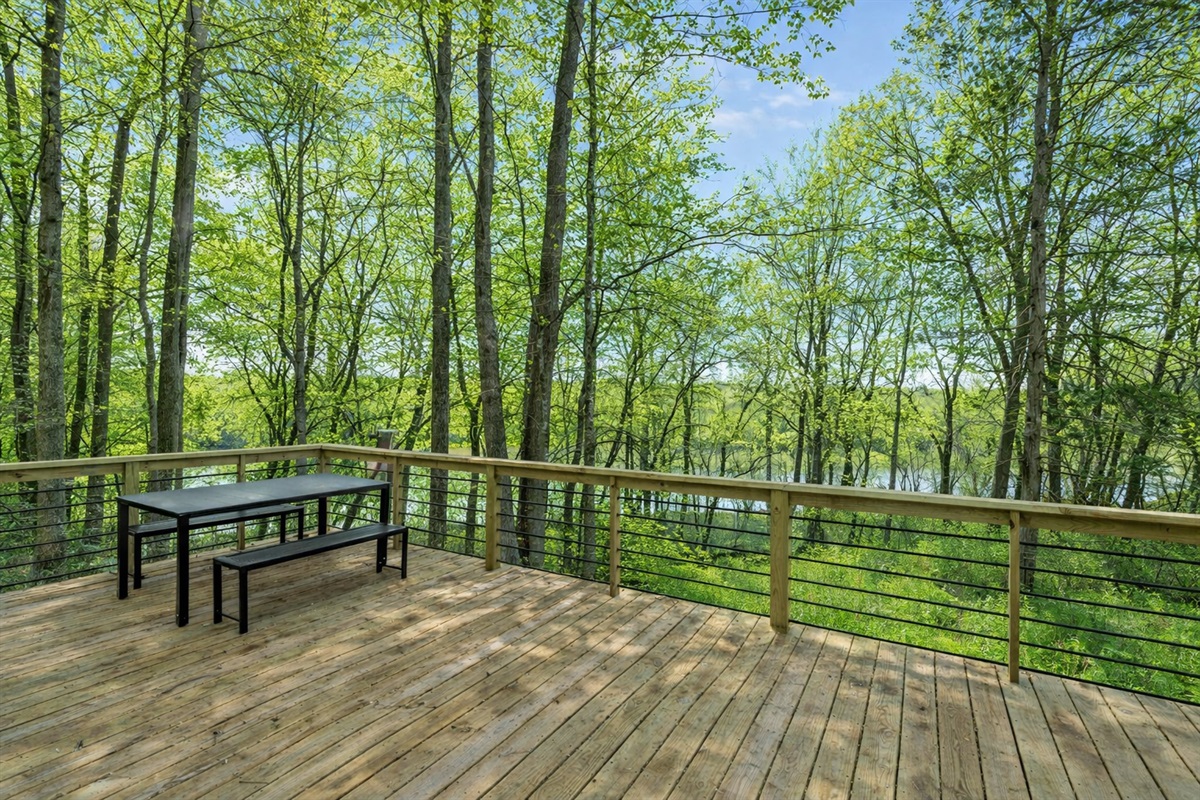 Outdoor Deck: Revel in nature’s embrace with stunning views and a perfect spot for morning coffee!