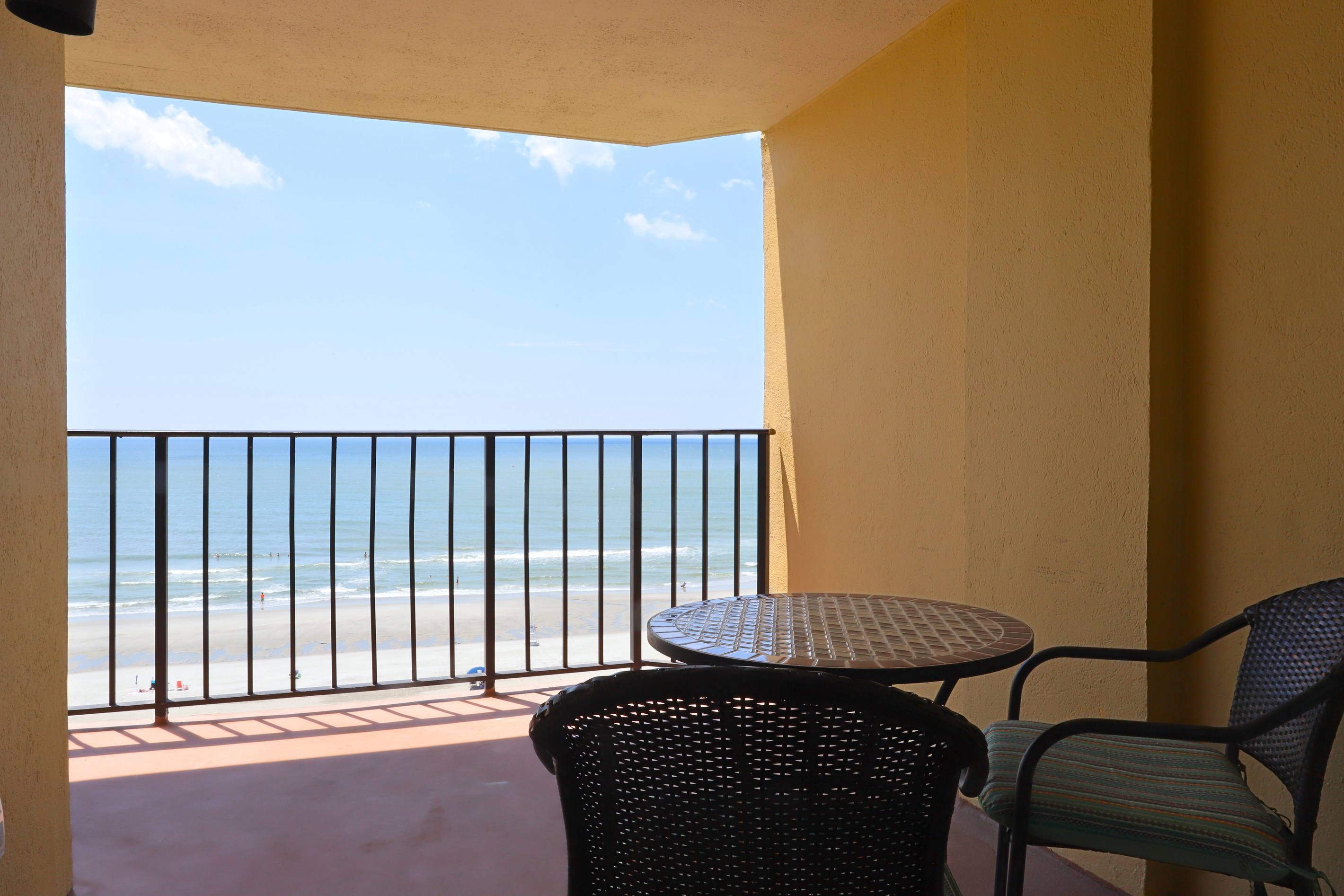 A private balcony with comfortable seating, offering stunning ocean views—an ideal spot to relax, unwind, and enjoy the tranquil beauty of the sea.