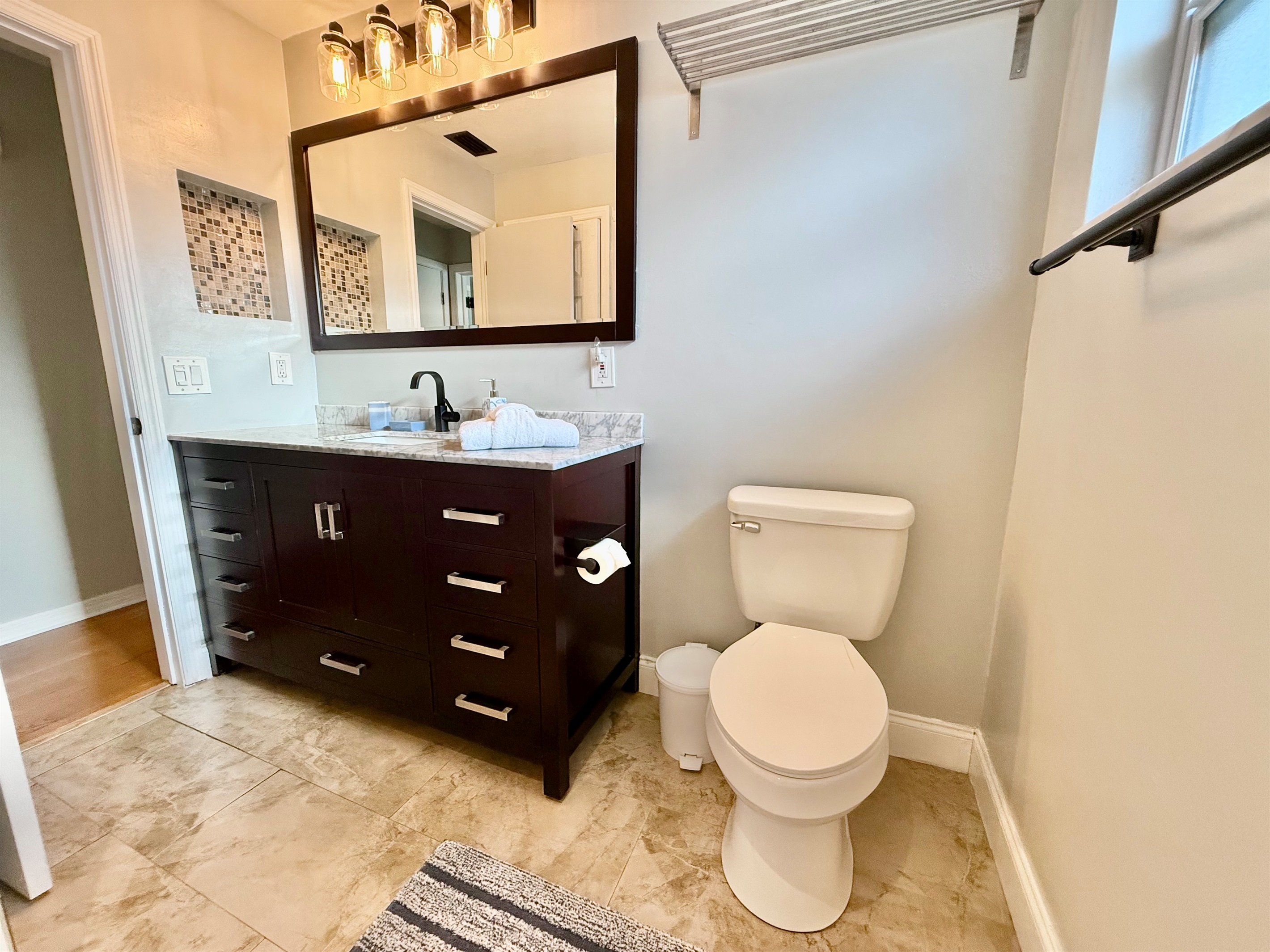 Clean, bright, and comfortable—this full bath offers plenty of counter space, and a peaceful atmosphere.