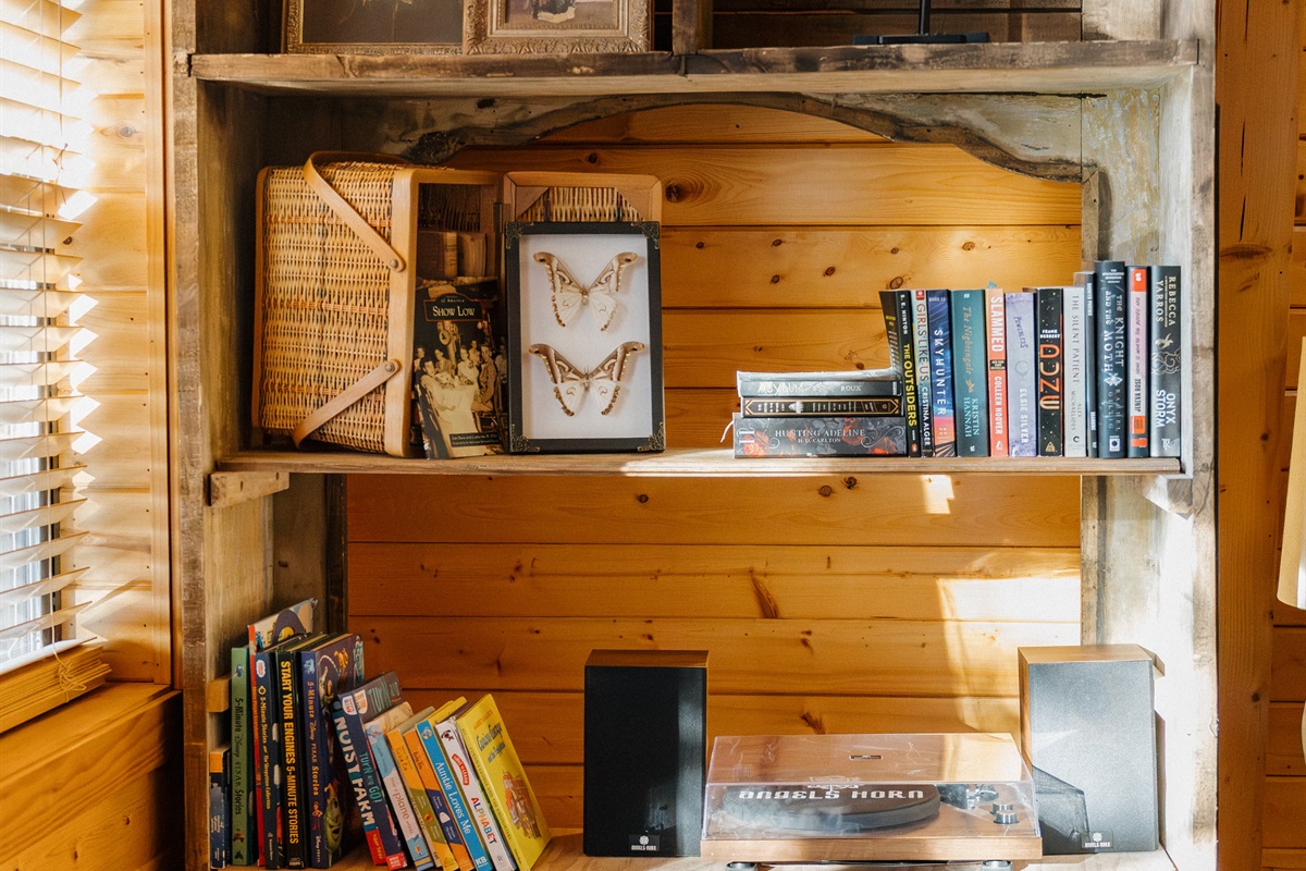 Rustic charm meets modern entertainment at Poppywood Pines. This gothic western A-frame in Show Low features curated decor, vintage records, and books for all ages. Your perfect White Mountains escape blends authentic character with cozy cabin comfort.