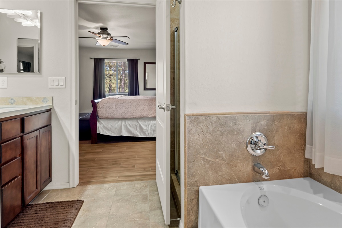 Unwind in the master bedroom, where a king bed and en-suite bathroom create a private sanctuary.