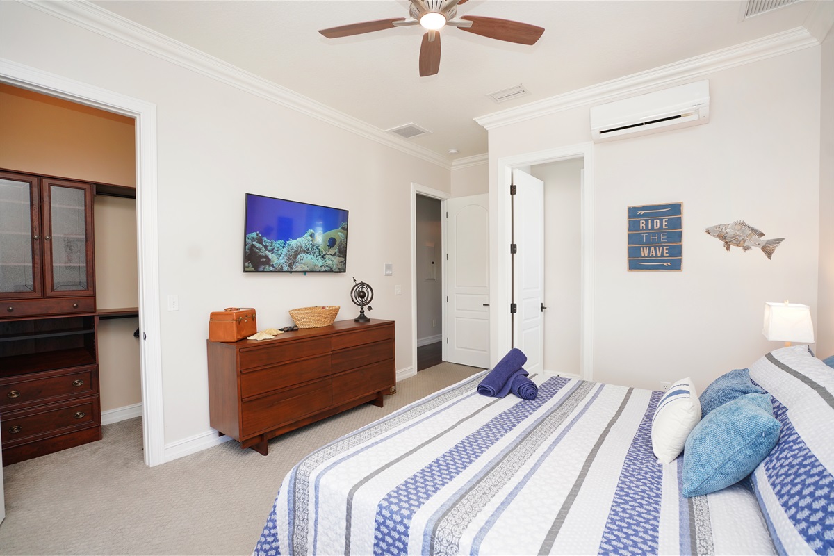 Second floor bedroom 4 offers a king bed, smart TV and ensuite.