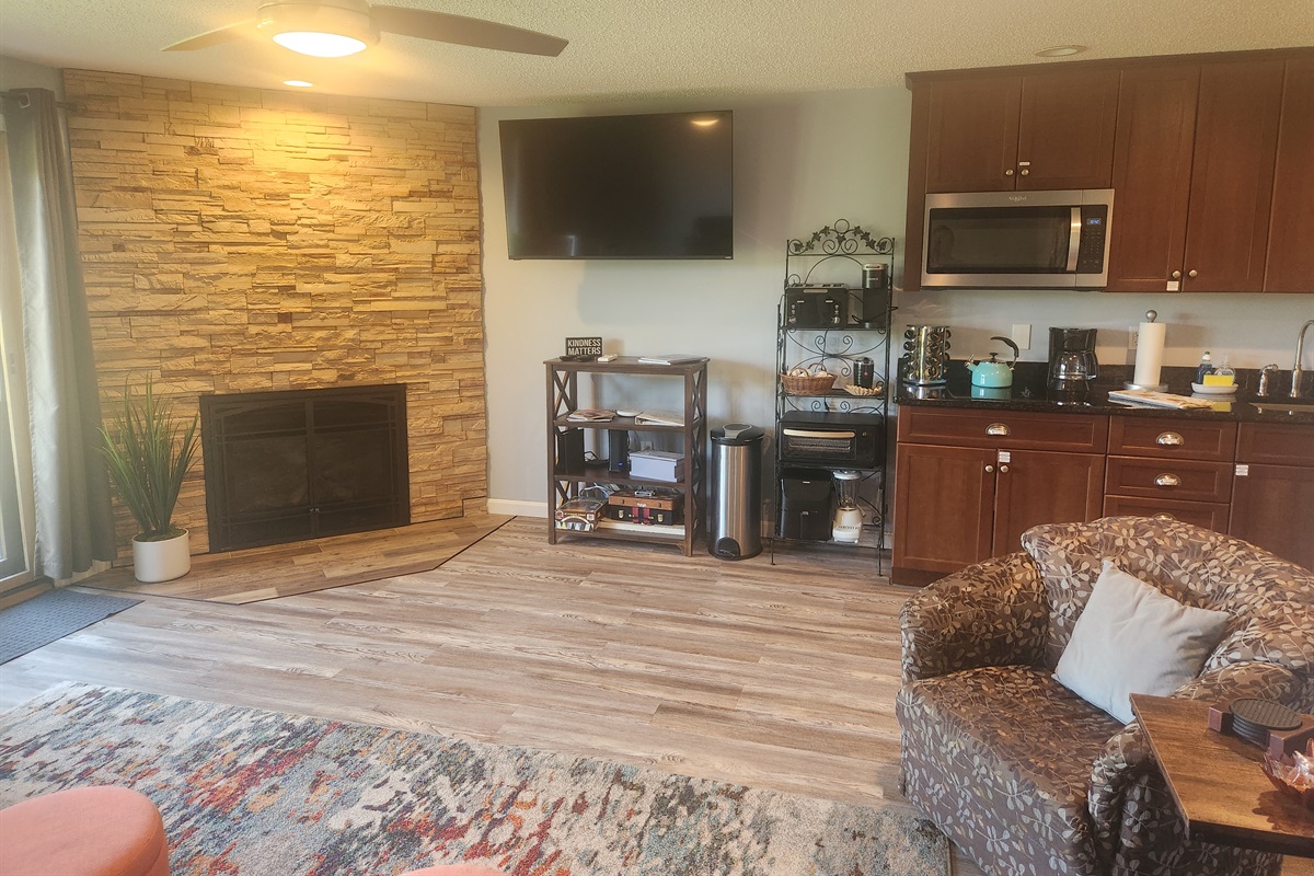 First floor fireplace and 55 Inch TV with Spectrum Cable