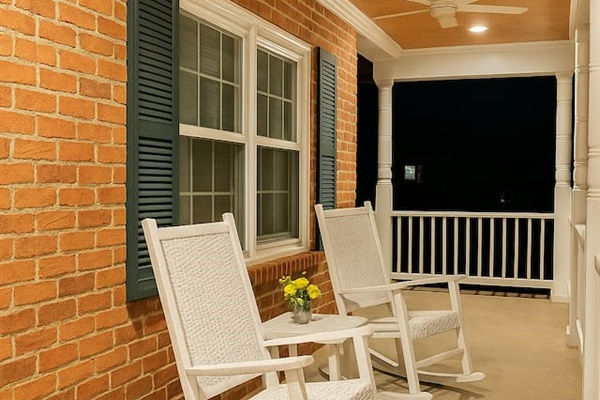 Relax on the front porch at dusk, where classic rocking chairs and warm lighting set the tone for a calm evening.   Smoking is allowed here 