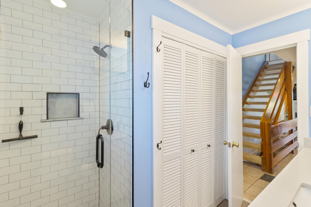 Your brand-new tile shower in the guest bath is polished and fresh &mdash; updated finishes that feel far better than typical.