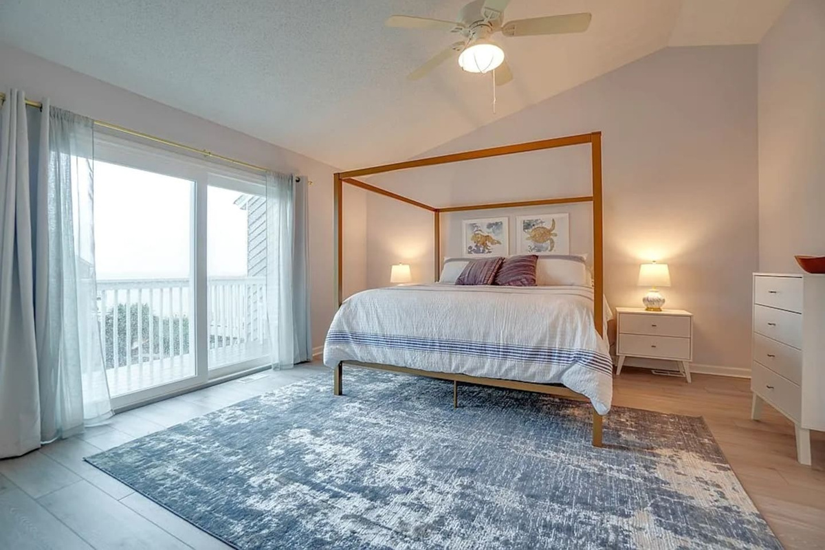 Wake up here, push open the glass door, and you're standing on your private top-floor deck with the Gulf stretching out in front of you.