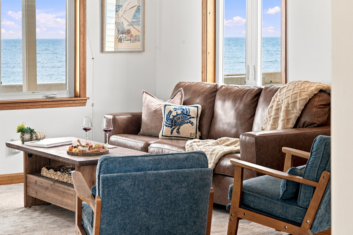 Cozy living room with comfortable seating and beautiful ocean views.