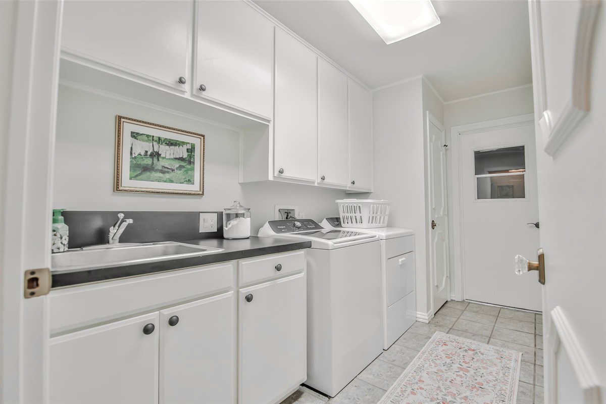Even the help would swoon. Modern conveniences discreetly tucked away: washer, dryer, and ample space to refresh gowns, cravats, and common attire.