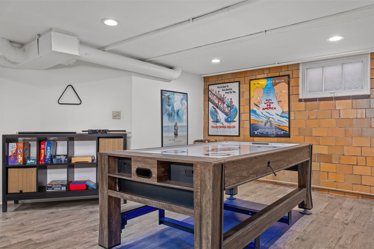 Enjoy some healthy competition using the convertible Pool/Air Hockey table and family games.