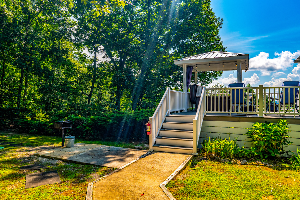 Off the back deck you will find a park-style, charcoal grill.