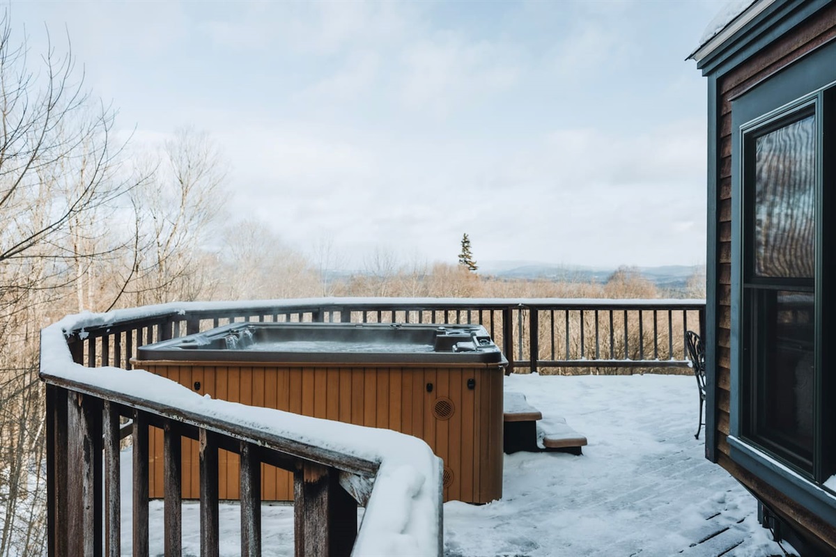 The hot tub is located on the upper deck, just a quick scurry from the house! 