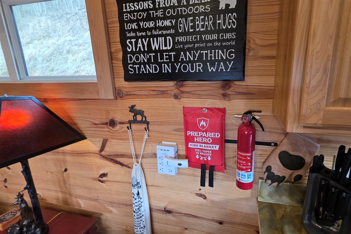 Marshmallow sticks and fire safety equipment in the kitchen.