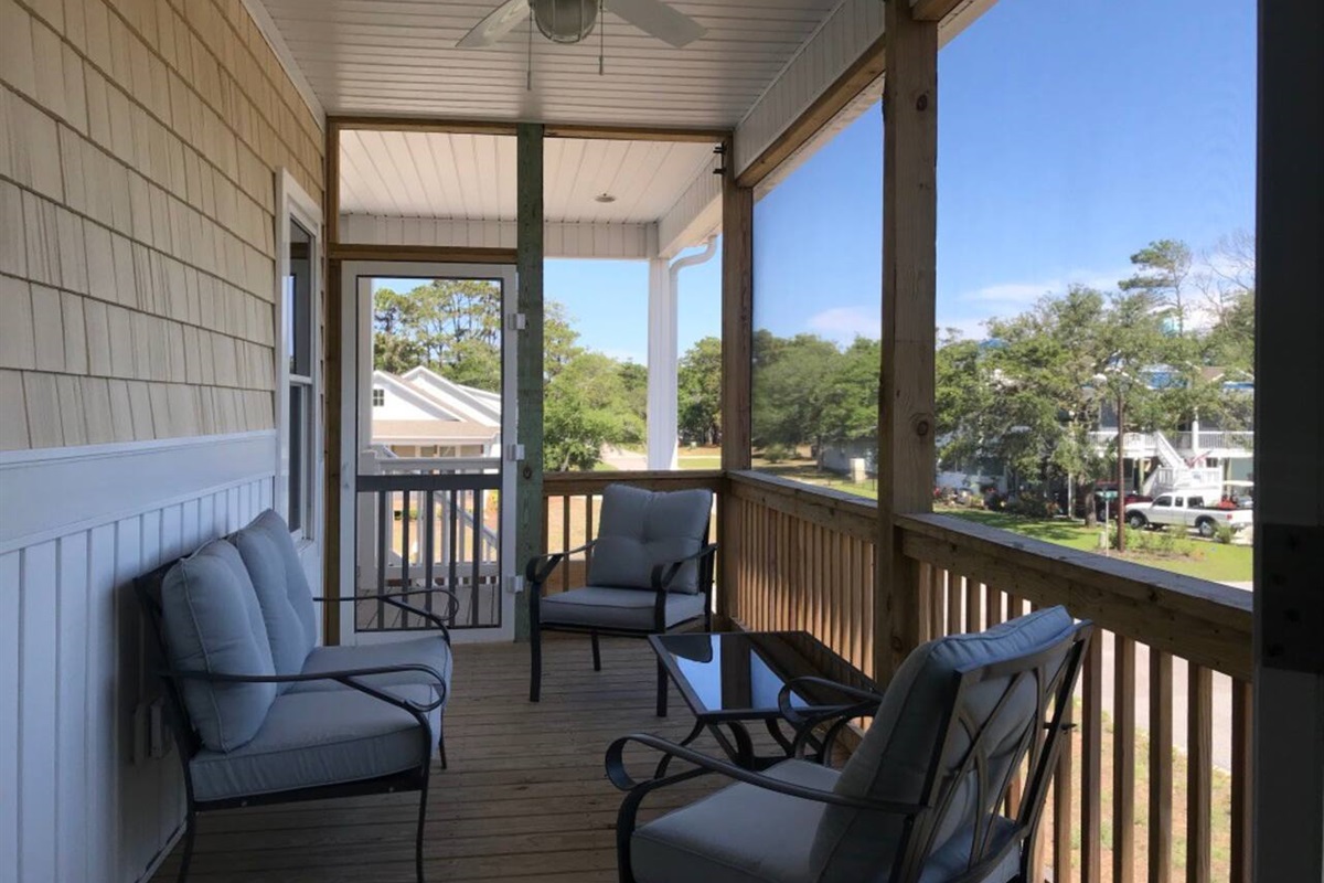 Enjoy ocean breeze and morning coffee from this screen porch