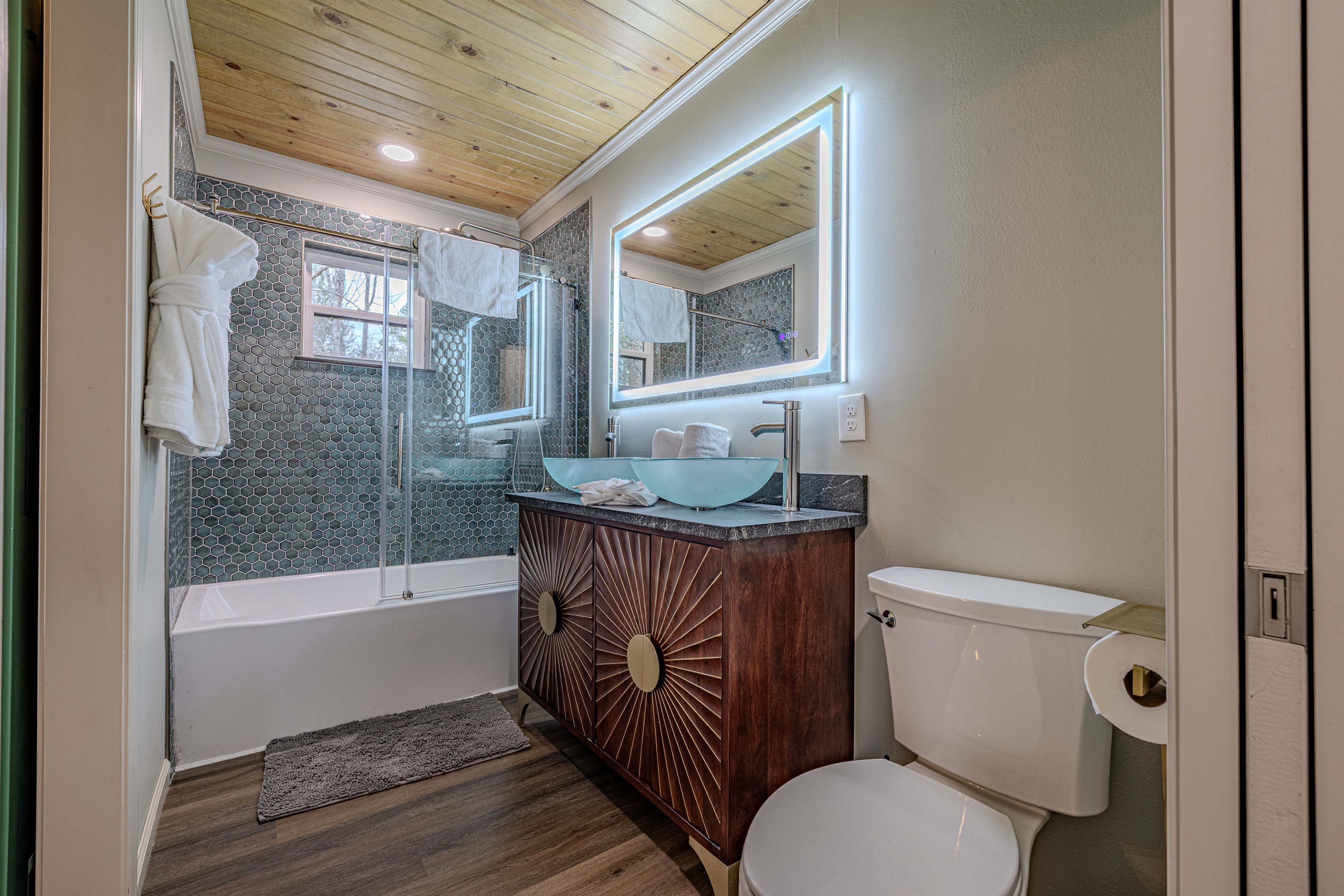 Our stylish bathroom serves as a private oasis, blending architectural interest with all the comforts of home.