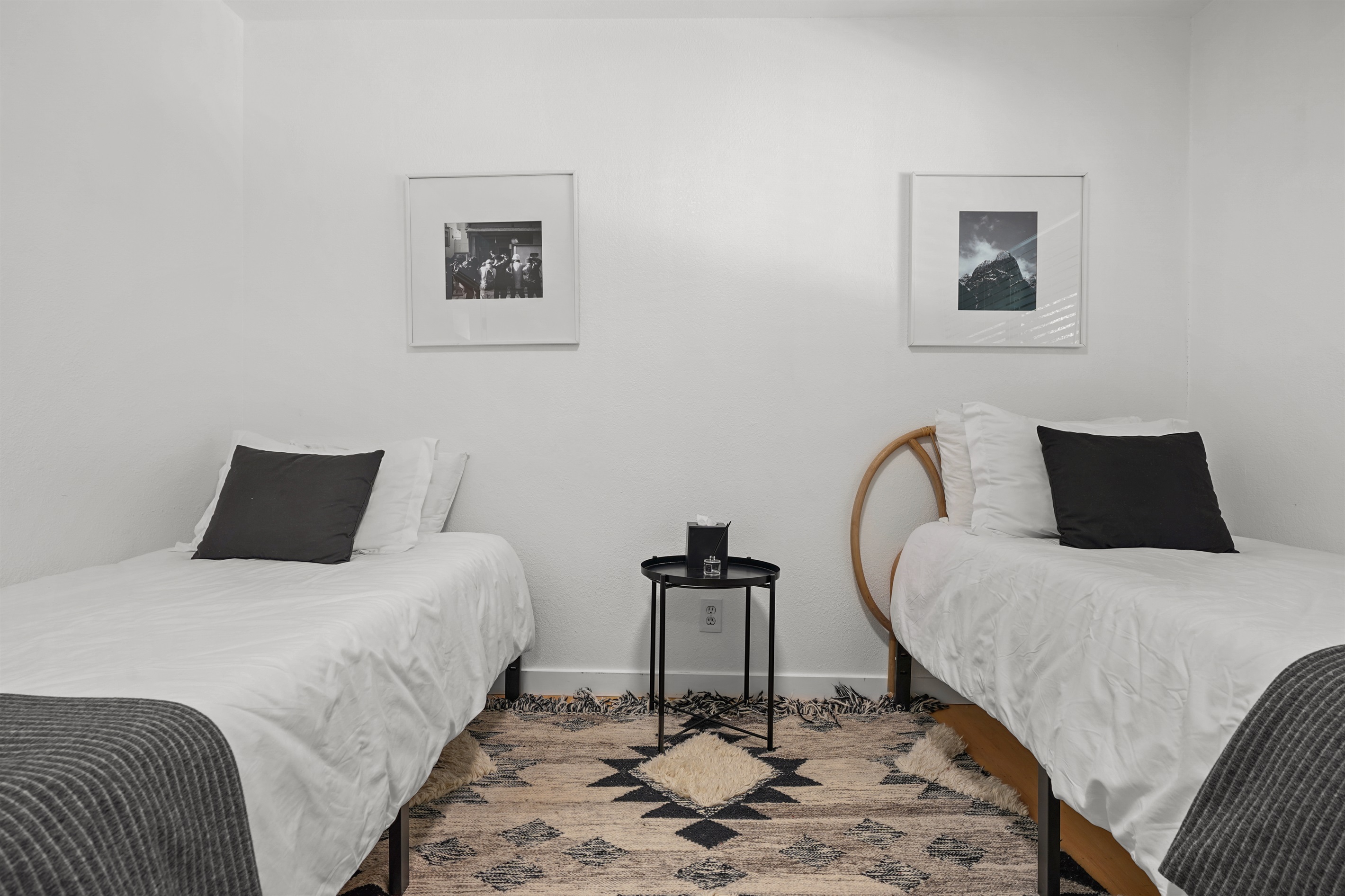 Perfect for kids, friends, or additional guests, this charming bedroom features two twin beds and a comfortable, relaxing setting.