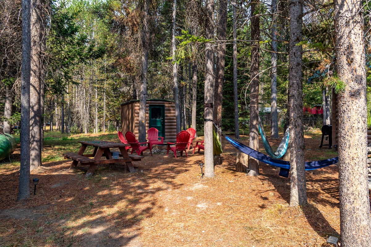 Relax outdoors with hammocks, a fire pit, picnic table, and convenient bathhouse.