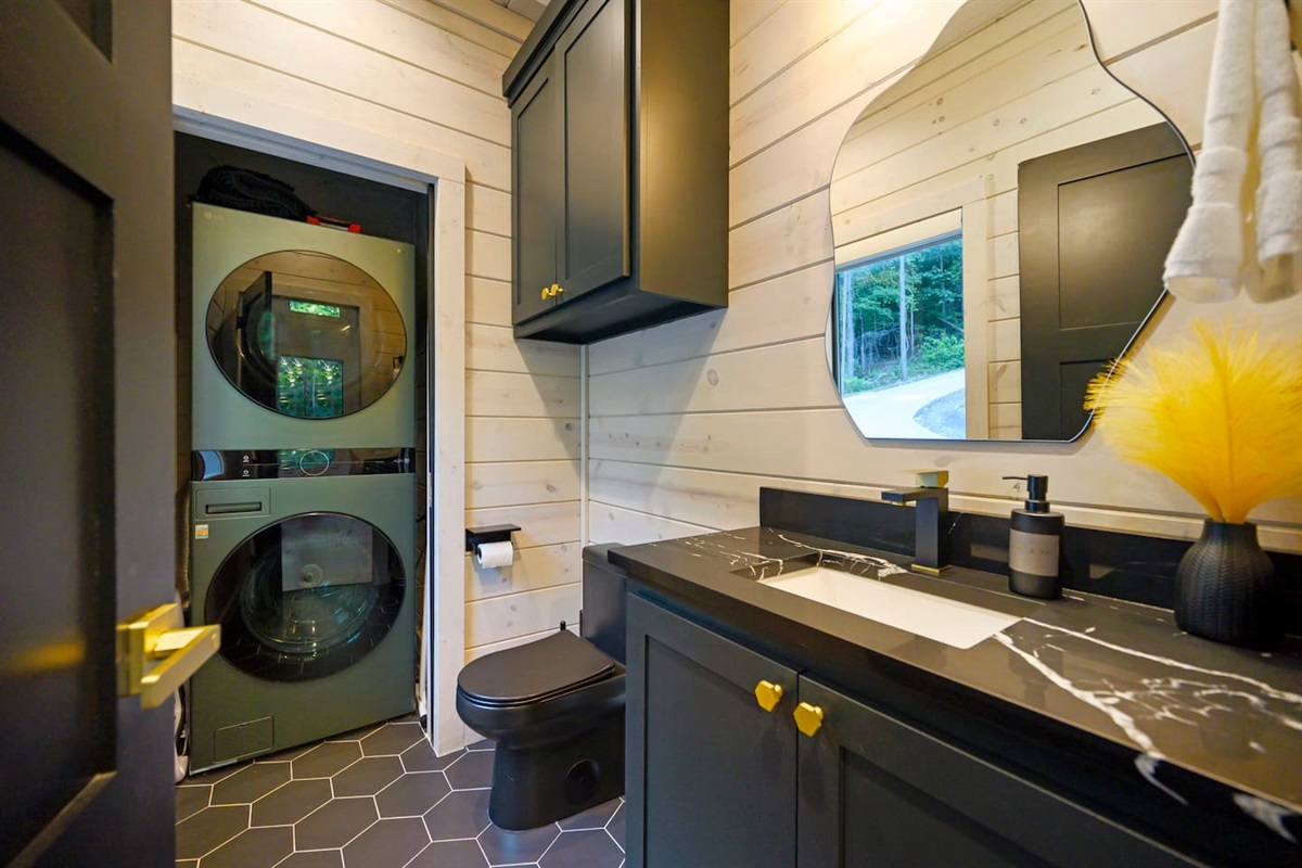 The full size washtower in the powder bathroom is accessible to guests at no extra cost.