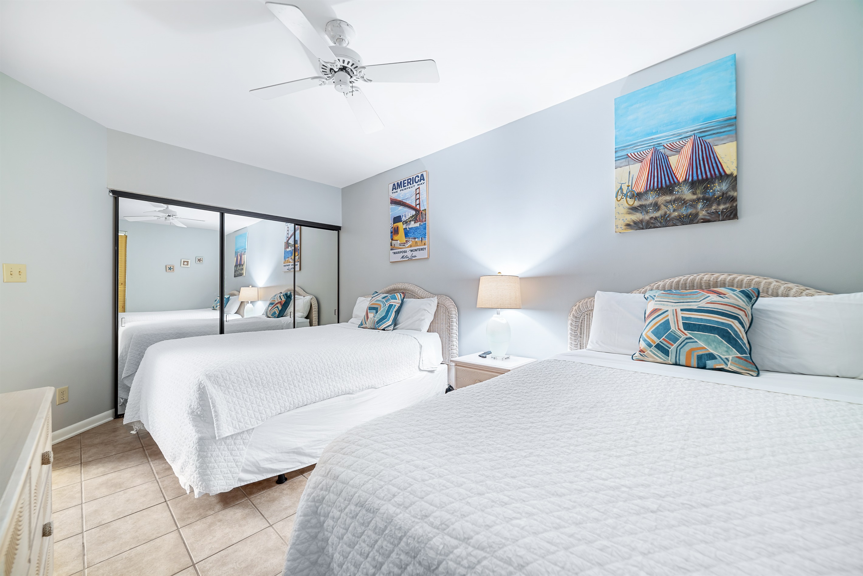 A charming bedroom featuring two comfortable twin beds, perfect for sharing and relaxation after a day of coastal adventures.