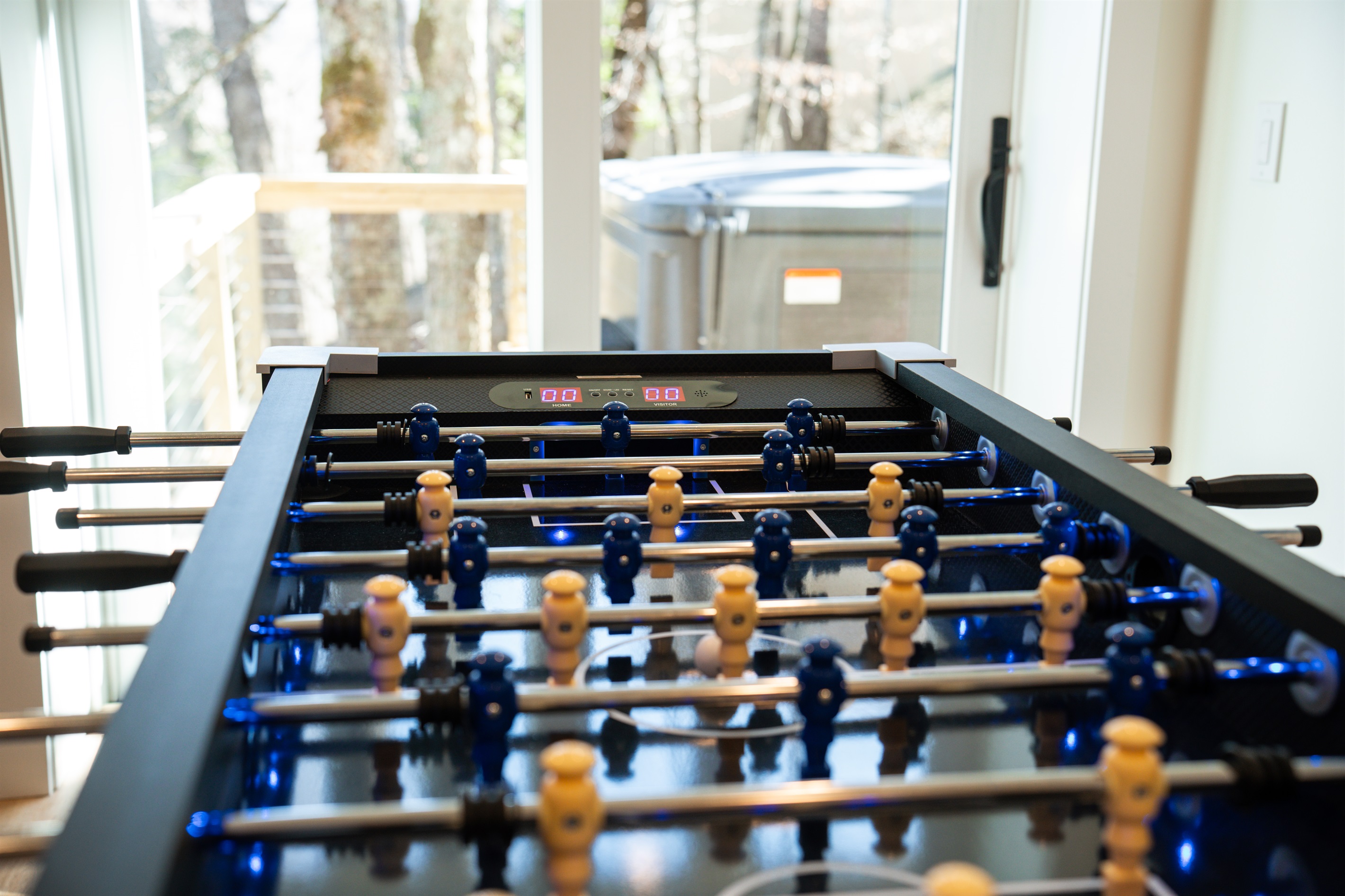 Enjoy a game of foosball with a glowing ball and electronic score keeping.  