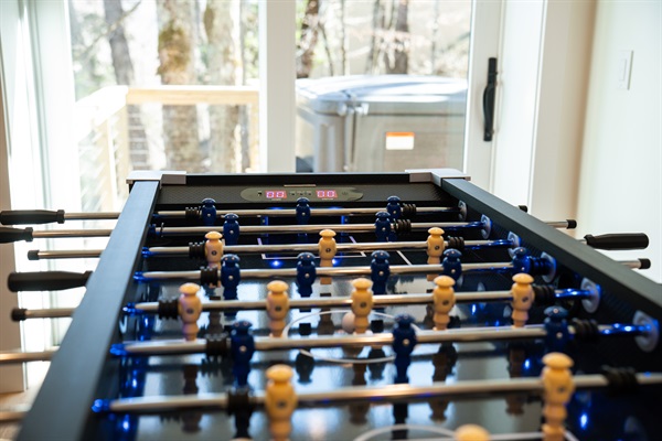 Enjoy a game of foosball with a glowing ball and electronic score keeping.  