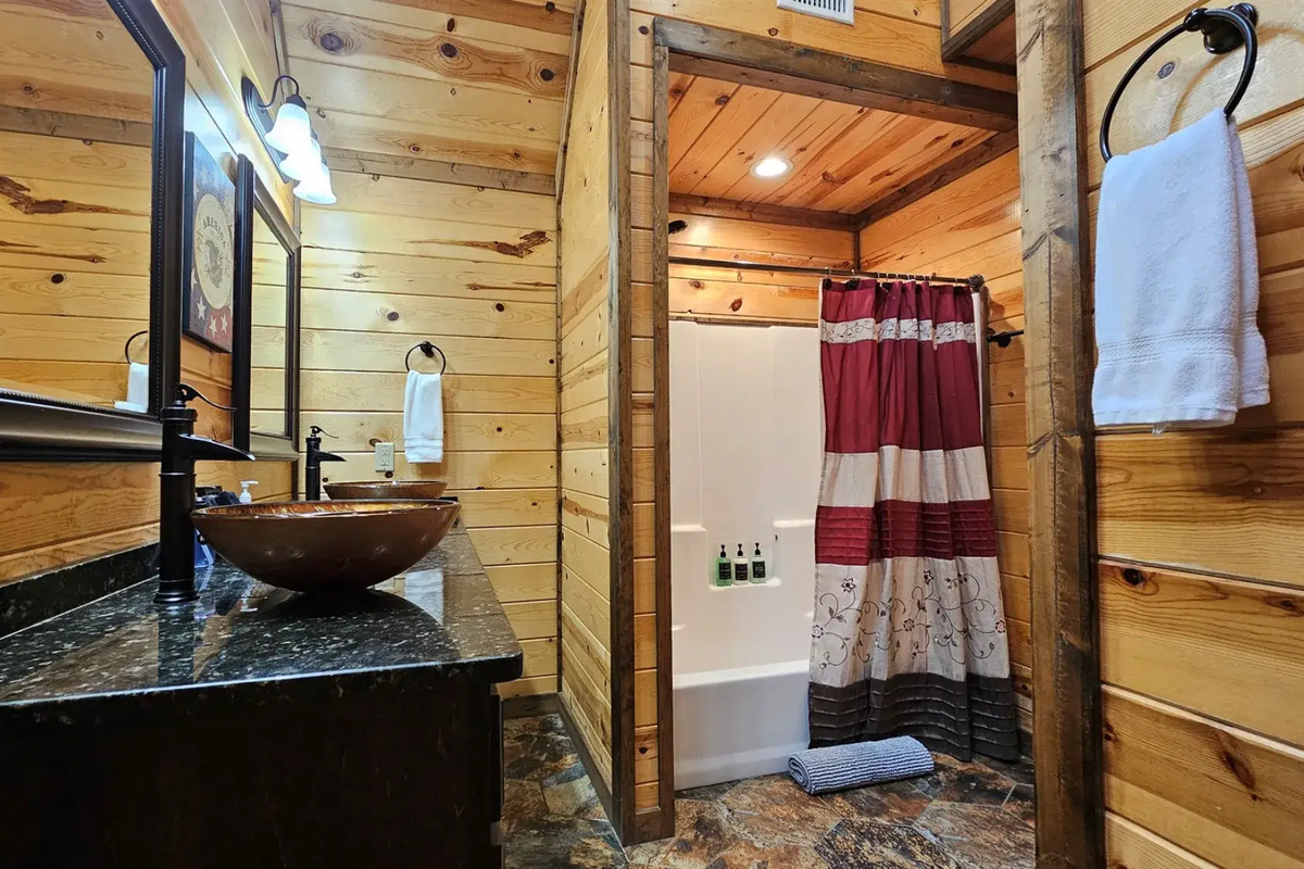 Bathroom Oasis: Natural wood accents and stylish fixtures create a rejuvenating retreat!