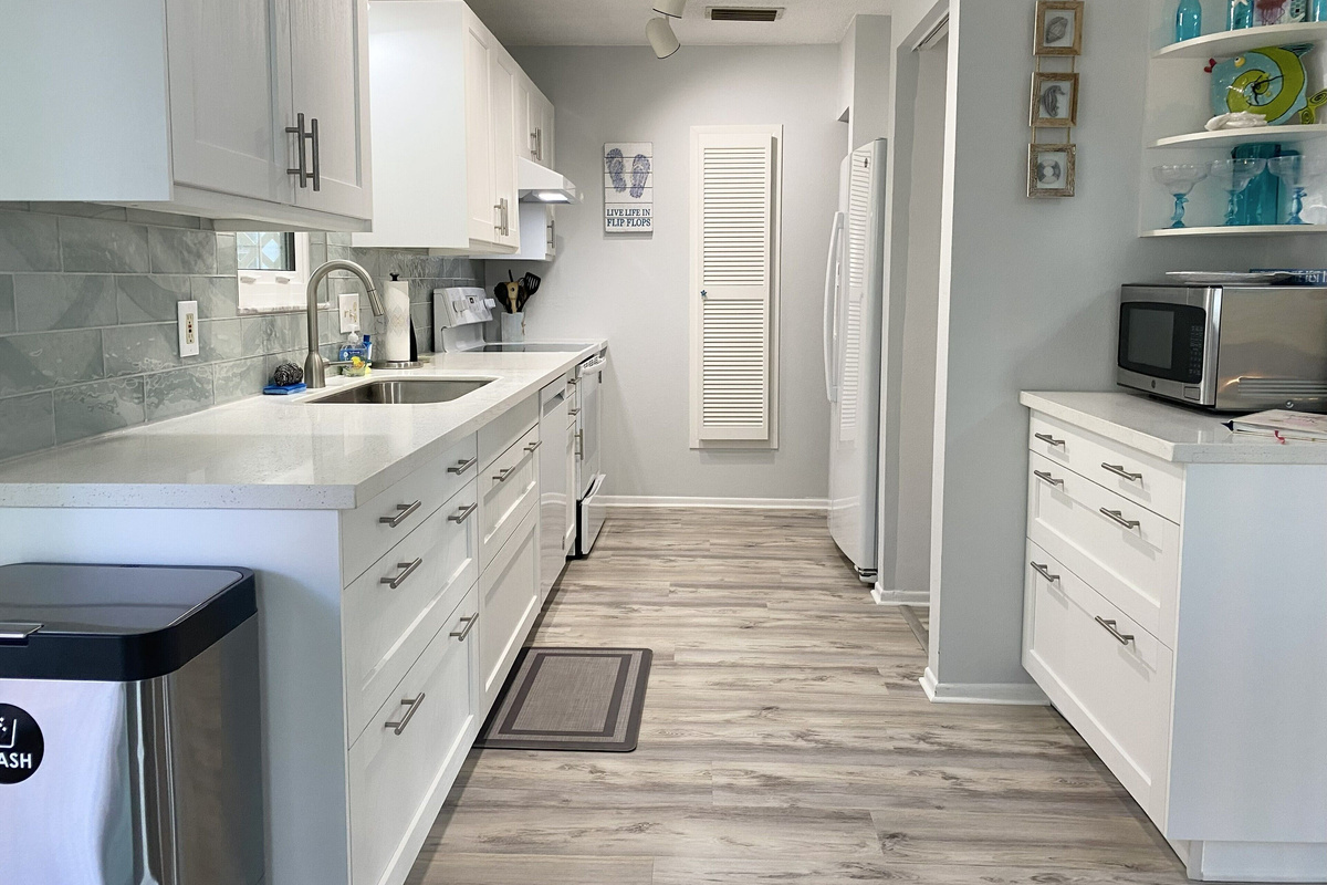 Clean up is a breeze with large sink, dishwasher and even the high capacity washer and dryer in the garage below! 